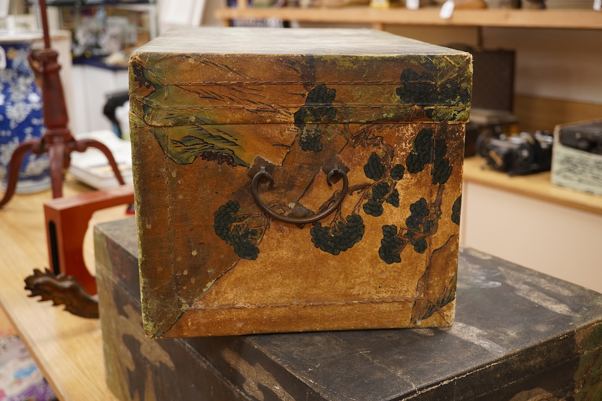 Two Chinese polychrome decorated hide chests, largest 56cm wide